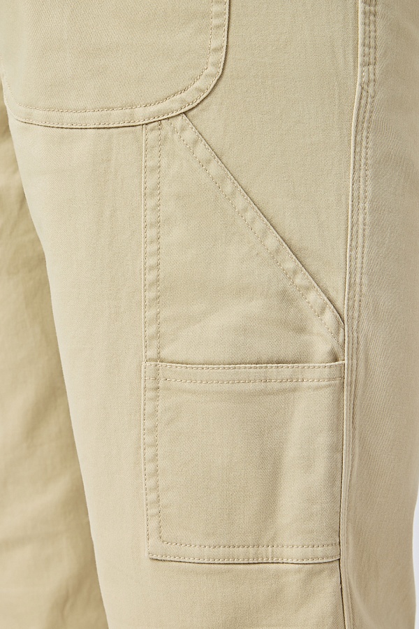 Бежевые хлопковые брюки с карманами
